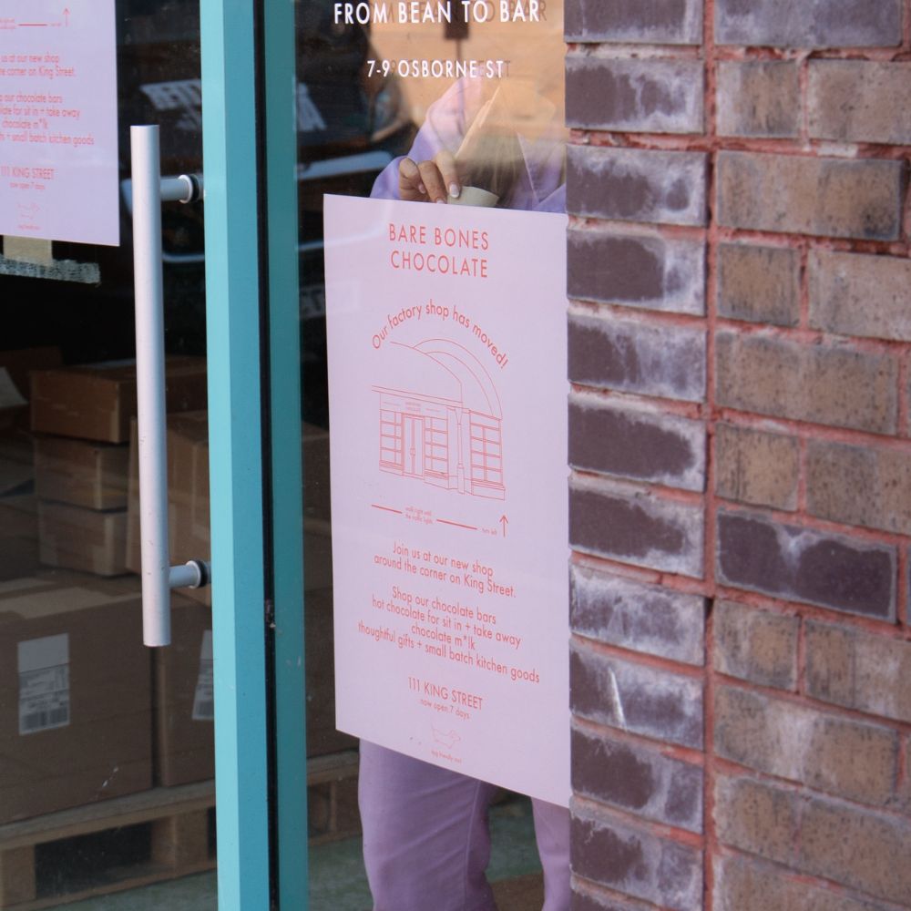 A small poster for a shop window advertising a factory move
